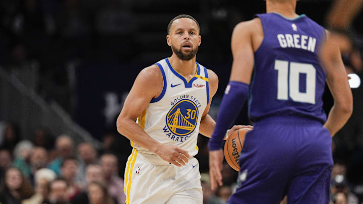 Mar 3, 2025; Charlotte, North Carolina, USA; Golden State Warriors guard Stephen Curry (30) brings the ball up court against the Charlotte Hornets during  the second quarter at Spectrum Center. Mandatory Credit: Jim Dedmon-Imagn Images