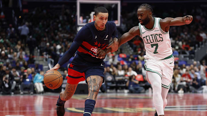 Nov 22, 2024; Washington, District of Columbia, USA; Washington Wizards forward Kyle Kuzma (33) drives to the basket as Boston Celtics guard Jaylen Brown (7) defends in the second half at Capital One Arena. Mandatory Credit: Geoff Burke-Imagn Images