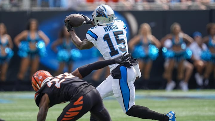 Sep 29, 2024; Charlotte, North Carolina, USA; Carolina Panthers wide receiver Jonathan Mingo (15) makes a catch defended by Cincinnati Bengals cornerback Dax Hill (23) during the second quarter at Bank of America Stadium. Mandatory Credit: Jim Dedmon-Imagn Images