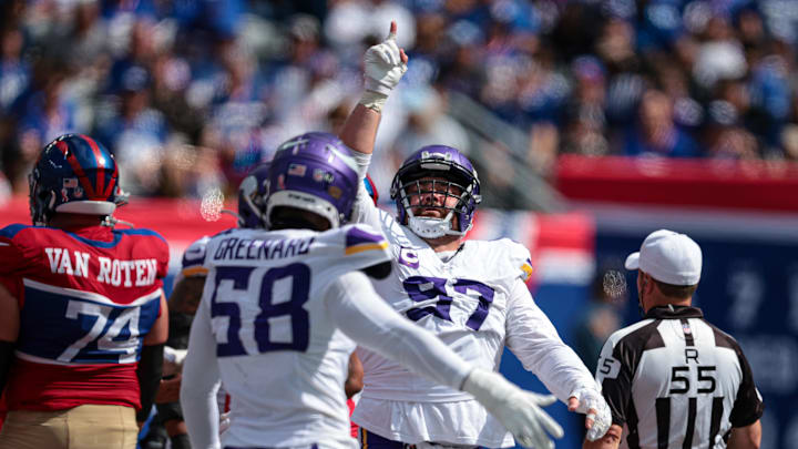 Sep 8, 2024; East Rutherford, New Jersey, USA; Minnesota Vikings defensive tackle Harrison Phillips (97) celebrates a defensive stop during the second half against the New York Giants at MetLife Stadium. Mandatory Credit: Vincent Carchietta-Imagn Images