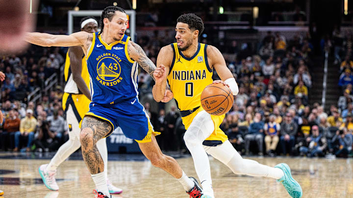 Jan 10, 2025; Indianapolis, Indiana, USA; Indiana Pacers guard Tyrese Haliburton (0) dribbles the ball while Golden State Warriors forward Lindy Waters III (43) defends in the second half at Gainbridge Fieldhouse. Mandatory Credit: Trevor Ruszkowski-Imagn Images Jan 10, 2025; Indianapolis, Indiana, USA; Indiana Pacers guard Tyrese Haliburton (0) dribbles the ball while Golden State Warriors forward Lindy Waters III (43) defends in the second half at Gainbridge Fieldhouse. Mandatory Credit: Trevor Ruszkowski-Imagn Images