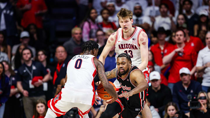 Feb 15, 2025; Tucson, Arizona, USA; Arizona Wildcats guard Jaden Bradley (0) steals the ball from Houston Cougars forward J’Wan Roberts (13) during the second half at McKale Center. Mandatory Credit: Aryanna Frank-Imagn Images