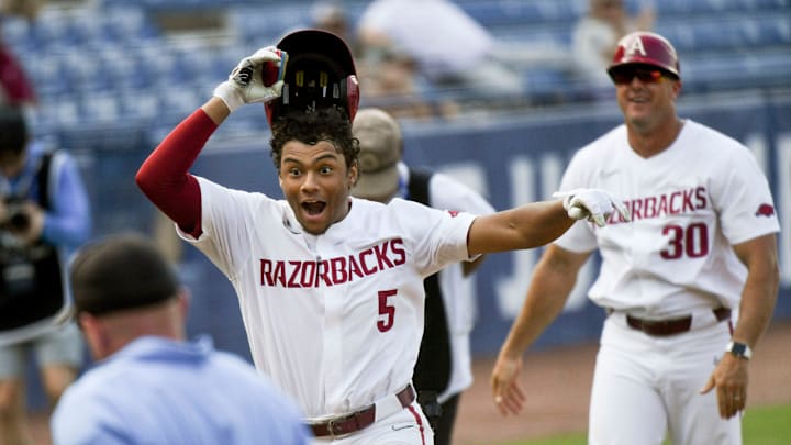Arkansas batter Kendall Diggs celebrates after hitting the walk-off solo homer in extra innings to down Texas A&M 6-5 during the second round of the SEC Baseball Tournament at the Hoover Met Wednesday, May 24, 2023.