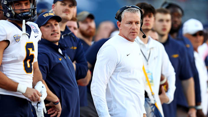 Toledo Rockets head coach Jason Candle looks on from the sidelines during the second half against the Wyoming Cowboys in the Arizona Bowl at Arizona Stadium. Toledo Rockets head coach Jason Candle looks on from the sidelines during the second half against the Wyoming Cowboys in the Arizona Bowl at Arizona Stadium.