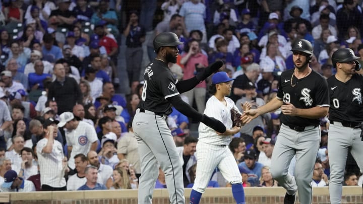 Jun 4, 2024; Chicago, Illinois, USA; Chicago White Sox shortstop Paul DeJong (29) is greeted by Luis Robert during the fourth inning at Wrigley Field. Mandatory Credit: David Banks-USA TODAY Sports