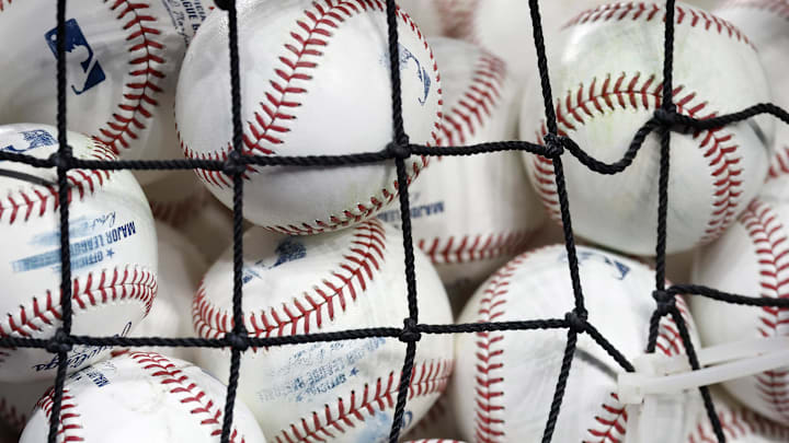 Jul 21, 2025; Miami, Florida, USA;  A bucket of baseballs sits on the field before the game between the San Diego Padres and the Miami Marlins at loanDepot Park. Mandatory Credit: Rhona Wise-Imagn Images