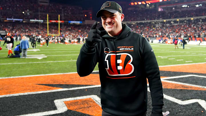 Bengals coach Zac Taylor gestures toward the fans after Cincinnati beat the Raiders to win the AFC Wild Card game