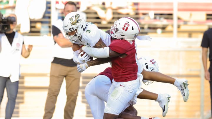 Sep 16, 2023; Stanford, California, USA; Sacramento State Hornets wide receiver Chris Miller (3) is tackled by Stanford Cardinal linebacker Gaethan Bernadel (0) during the second quarter at Stanford Stadium. Mandatory Credit: Sergio Estrada-USA TODAY Sports
