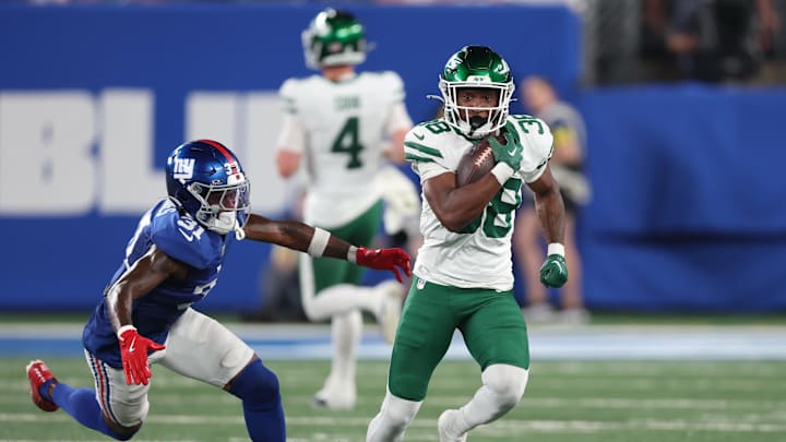 New York Jets running back Lawrance Toafili (38) carries the ball against the New York Giants. New York Jets running back Lawrance Toafili (38) carries the ball against the New York Giants.