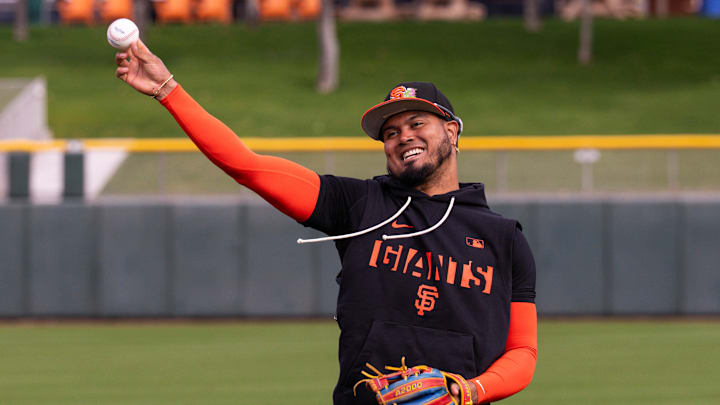 Feb 16, 2026; Scottsdale, AZ, USA;San Francisco Giants second baseman Luis Arraez throws during workouts at Scottsdale Stadium in Scottsdale, Arizona.  Mandatory Credit: Arianna Grainey-Imagn Images