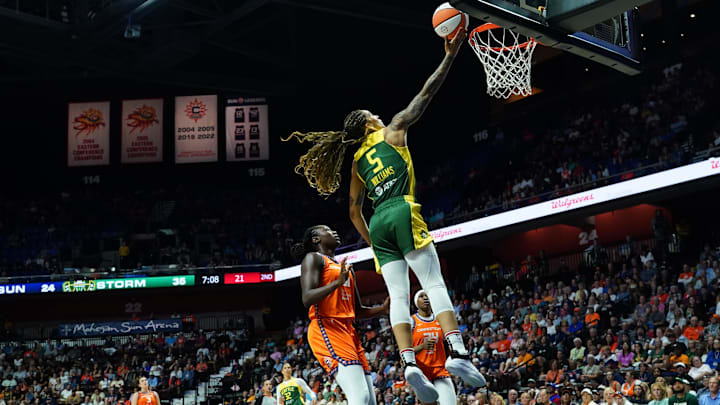 Jul 28, 2025; Uncasville, Connecticut, USA; Seattle Storm forward Gabby Williams (5) drives the ball to the basket against the Connecticut Sun in the first half at Mohegan Sun Arena. Jul 28, 2025; Uncasville, Connecticut, USA; Seattle Storm forward Gabby Williams (5) drives the ball to the basket against the Connecticut Sun in the first half at Mohegan Sun Arena.