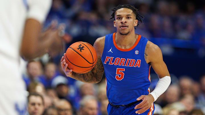 Jan 4, 2025; Lexington, Kentucky, USA; Florida Gators guard Will Richard (5) brings the ball up court during the first half against the Kentucky Wildcats at Rupp Arena at Central Bank Center. Mandatory Credit: Jordan Prather-Imagn Images