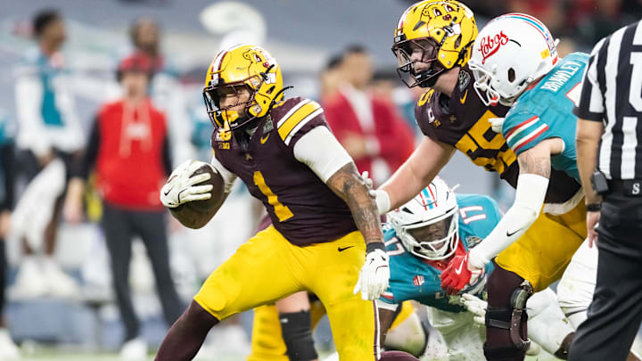 Dec 26, 2025; Phoenix, AZ, USA; Minnesota Golden Gophers running back Darius Taylor (1) against the New Mexico Lobos during the Rate Bowl at Chase Field. Mandatory Credit: Mark J. Rebilas-Imagn Images