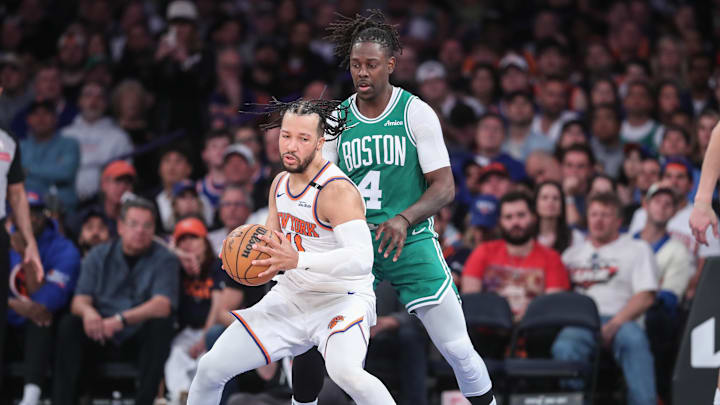 New York Knicks guard Jalen Brunson looks to drive past Boston Celtics guard Jrue Holiday. Mandatory Credit: Wendell Cruz-Imagn Images