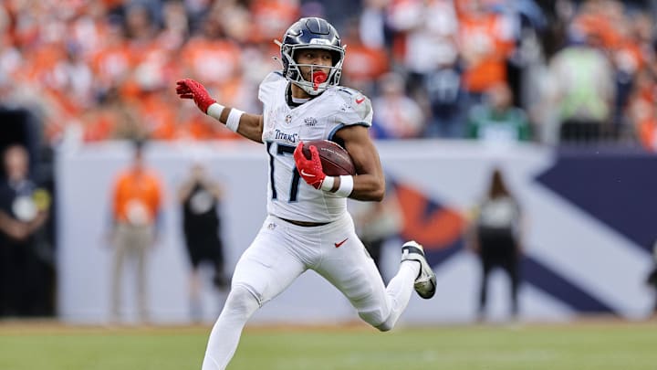 Sep 7, 2025; Denver, Colorado, USA; Tennessee Titans wide receiver Chimere Dike (17) runs with the ball against the Denver Broncos in the first half at Empower Field at Mile High. Mandatory Credit: Isaiah J. Downing-Imagn Images Sep 7, 2025; Denver, Colorado, USA; Tennessee Titans wide receiver Chimere Dike (17) runs with the ball against the Denver Broncos in the first half at Empower Field at Mile High. Mandatory Credit: Isaiah J. Downing-Imagn Images