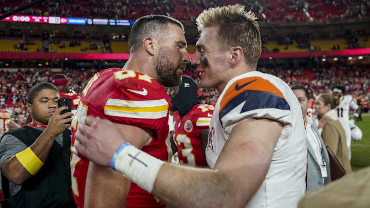 Dec 25, 2025; Kansas City, Missouri, USA; Denver Broncos quarterback Bo Nix (10) and Kansas City Chiefs tight end Travis Kelce (87) after the game at GEHA Field at Arrowhead Stadium. Mandatory Credit: Denny Medley-Imagn Images