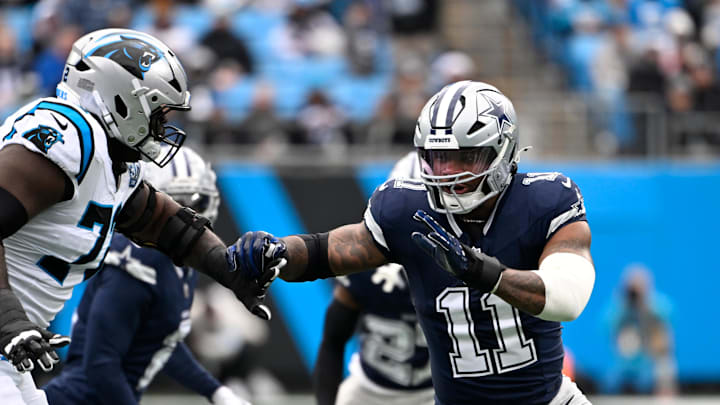 Dallas Cowboys linebacker Micah Parsons rushes as Carolina Panthers offensive tackle Taylor Moton defends