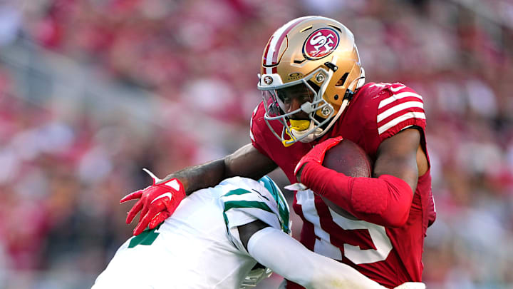 New York Jets cornerback D.J. Reed (L) tackles San Francisco 49ers wide receiver Jauan Jennings (R)
