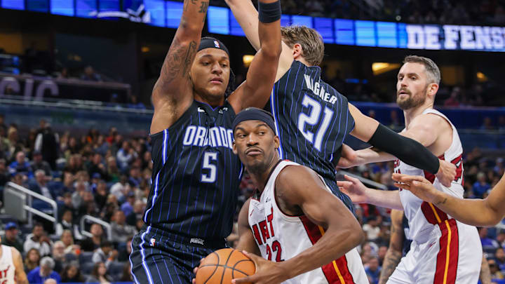 Jan 21, 2024; Orlando, Florida, USA; Miami Heat forward Jimmy Butler (22) looks to pass against