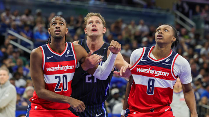 Nov 10, 2024; Orlando, Florida, USA; Washington Wizards forward Alexandre Sarr (20), guard Carlton Carrington (8) and Orlando Magic center Moritz Wagner (21) watch for the rebound during the second half at Kia Center. Mandatory Credit: Mike Watters-Imagn Images
