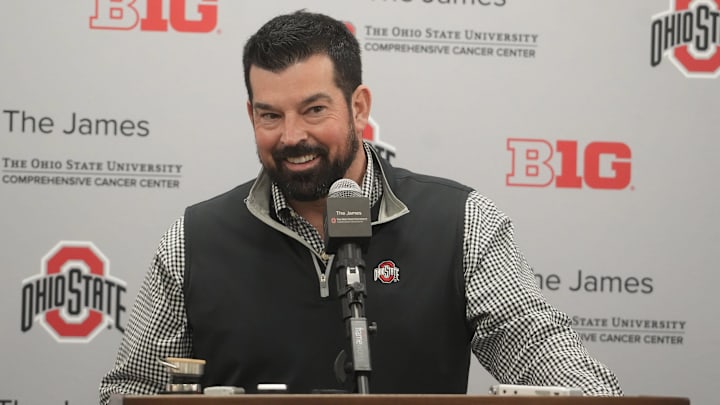 Dec 20, 2023; Columbus, Ohio, USA; Ohio State football coach Ryan Day smiles while reacting a question about the whims of high-school recruits. He held a news conference Wednesday, December 20, 2023 to discuss the class.