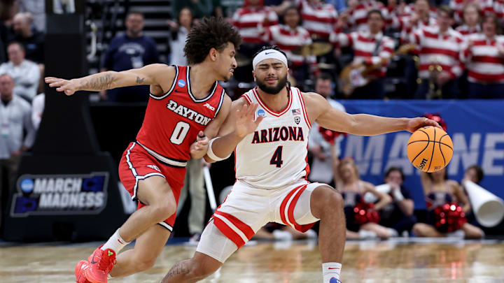 Mar 23, 2024; Salt Lake City, UT, USA; Arizona Wildcats guard Kylan Boswell (4) dribbles against Dayton Flyers guard Javon Bennett (0) during the first half in the second round of the 2024 NCAA Tournament at Vivint Smart Home Arena-Delta Center. Mandatory Credit: Rob Gray-USA TODAY Sports