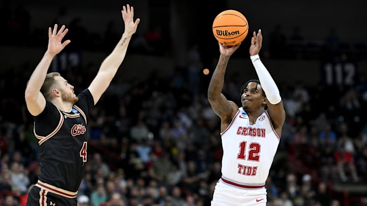 Mar 22, 2024; Spokane, WA, USA; Alabama Crimson Tide guard Latrell Wrightsell Jr. (12) shoots against Charleston Cougars guard Bryce Butler (4) during the second half in the first round of the 2024 NCAA Tournament at Spokane Veterans Memorial Arena. Mandatory Credit: James Snook-Imagn Images 