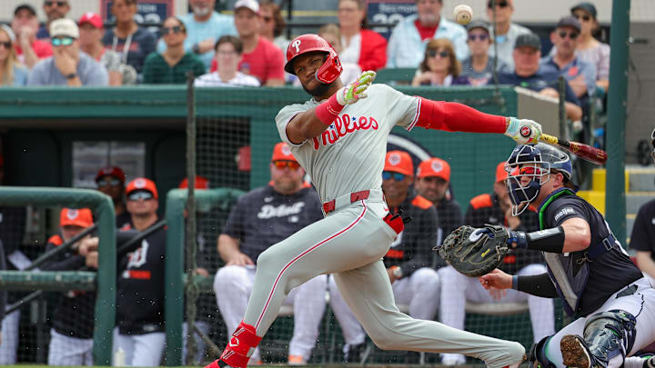 Feb 22, 2025; Lakeland, Florida, USA; Philadelphia Phillies outfielder Johan Rojas (18) bats during the third inning against the Detroit Tigers at Publix Field at Joker Marchant Stadium. Mandatory Credit: Mike Watters-Imagn Images