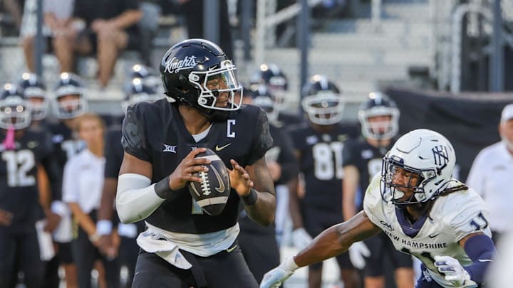Aug 29, 2024; Orlando, Florida, USA; UCF Knights quarterback KJ Jefferson (1) looks to pass during the first quarter against the New Hampshire Wildcats at FBC Mortgage Stadium. Mandatory Credit: Mike Watters-USA TODAY Sports