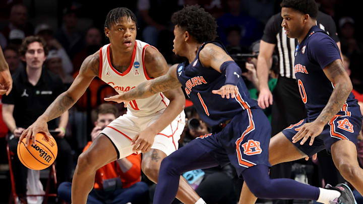 Mar 18, 2023; Birmingham, AL, USA; Houston Cougars guard Marcus Sasser (0) dribbles against Auburn Tigers guard Wendell Green Jr. (1) during the second half at Legacy Arena. Mandatory Credit: Vasha Hunt-USA TODAY Sports