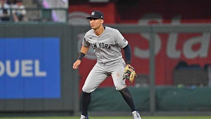 Jun 10, 2025; Kansas City, Missouri, USA;  New York Yankees shortstop Anthony Volpe (11) gets set on defense in the sixth inning against the Kansas City Royals at Kauffman Stadium. Mandatory Credit: Peter Aiken-Imagn Images