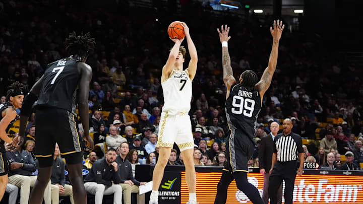 Jan 24, 2026; Boulder, Colorado, USA; Colorado Buffaloes forward Sebastian Rancik (7) shoots the ball over UCF Knights center John Bol (7) and forward Jordan Burks (99) in the second half at the CU Events Center. Mandatory Credit: Ron Chenoy-Imagn Images Jan 24, 2026; Boulder, Colorado, USA; Colorado Buffaloes forward Sebastian Rancik (7) shoots the ball over UCF Knights center John Bol (7) and forward Jordan Burks (99) in the second half at the CU Events Center. Mandatory Credit: Ron Chenoy-Imagn Images
