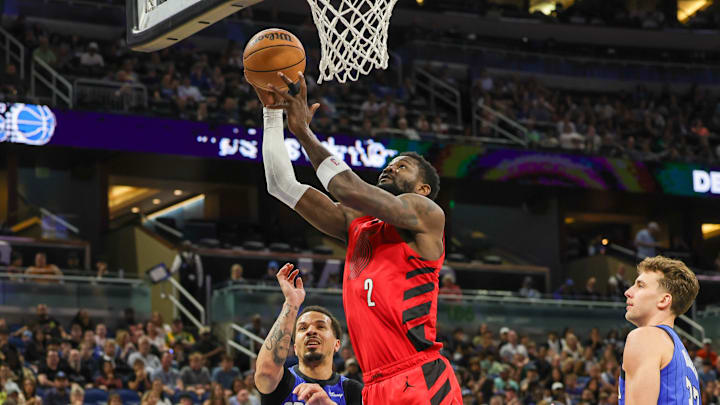 Apr 1, 2024; Orlando, Florida, USA; Portland Trail Blazers center Deandre Ayton (2) goes to the rim against the Magic. 