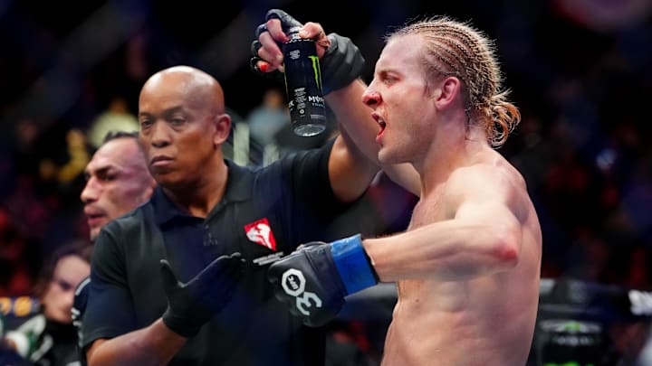 Dec 16, 2023; Las Vegas, Nevada, USA; Paddy Pimblett (blue gloves) reacts after defeating Tony Ferguson (not pictured) during UFC 296 at T-Mobile Arena. Mandatory Credit: Stephen R. Sylvanie-USA TODAY Sports