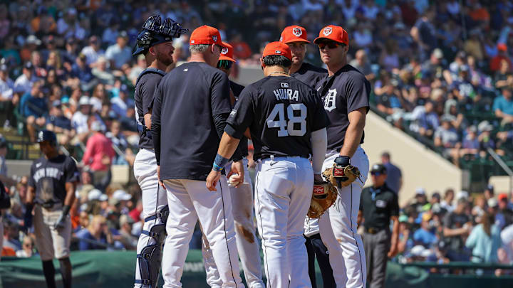 Detroit Tigers manager AJ Hinch holds a mound visit during the team's Spring Training opener.