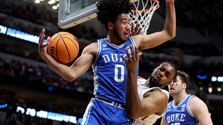 Mar 29, 2024; Dallas, TX, USA; Duke Blue Devils guard Jared McCain (0) rebounds against Houston Cougars forward J'Wan Roberts (13) during the first half in the semifinals of the South Regional of the 2024 NCAA Tournament at American Airlines Center. Mandatory Credit: Tim Heitman-USA TODAY Sports 