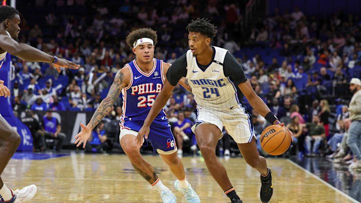 Oct 18, 2024; Orlando, Florida, USA; Orlando Magic guard Jarrett Culver (24) drives around Philadelphia 76ers guard Lester Quinones (25) during the second half at Kia Center. Mandatory Credit: Mike Watters-Imagn Images