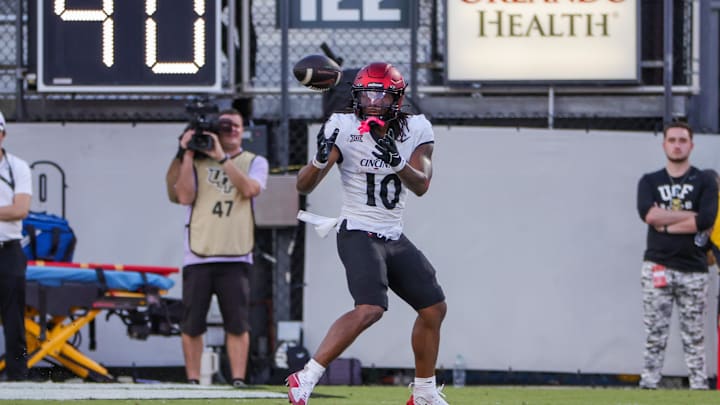 Oct 12, 2024; Orlando, Florida, USA; Cincinnati Bearcats wide receiver Jamoi Mayes (10) catches a pass during the second half against the UCF Knights at FBC Mortgage Stadium. Mandatory Credit: Mike Watters-Imagn Images