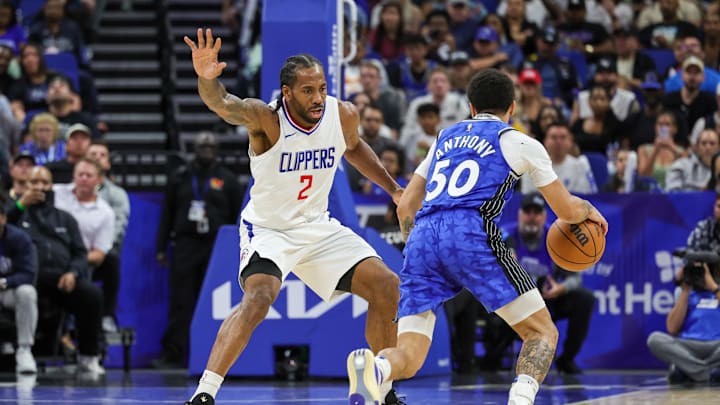 ; LA Clippers forward Kawhi Leonard (2) defends Orlando Magic guard Cole Anthony (50) during the second half at KIA Center. Mandatory Credit: Mike Watters-Imagn Images