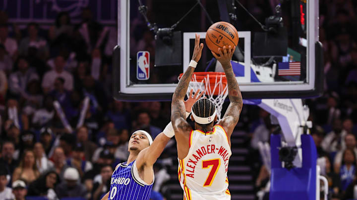 Oct 24, 2025; Orlando, Florida, USA; Atlanta Hawks guard Nickeil Alexander-Walker (7) shoots over Orlando Magic guard Anthony Black (0) during the second half at Kia Center. Mandatory Credit: Mike Watters-Imagn Images