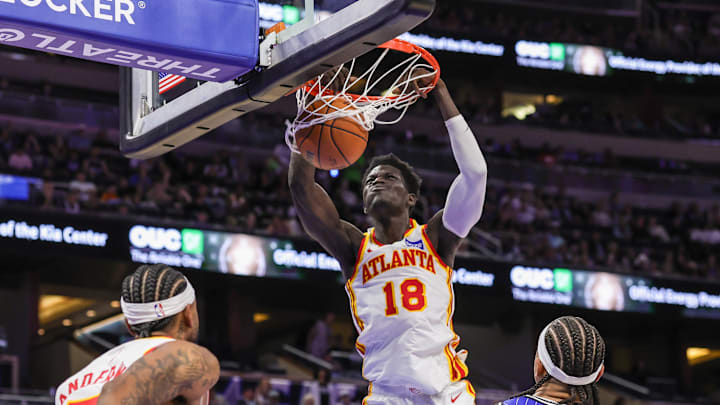 Oct 24, 2025; Orlando, Florida, USA; Atlanta Hawks forward Mouhamed Gueye (18) dunks during the second quarter against the Orlando Magic at Kia Center. Mandatory Credit: Mike Watters-Imagn Images
