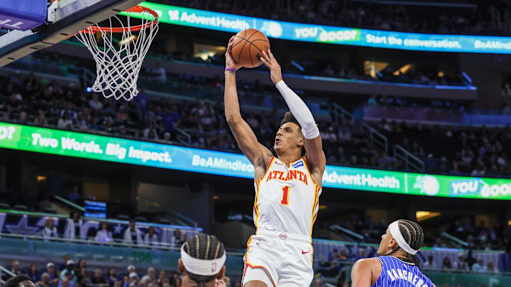 Oct 24, 2025; Orlando, Florida, USA; Atlanta Hawks forward Jalen Johnson (1) goes to the basket in front of Orlando Magic forward Paolo Banchero (5) during the first quarter at Kia Center. Mandatory Credit: Mike Watters-Imagn Images Oct 24, 2025; Orlando, Florida, USA; Atlanta Hawks forward Jalen Johnson (1) goes to the basket in front of Orlando Magic forward Paolo Banchero (5) during the first quarter at Kia Center. Mandatory Credit: Mike Watters-Imagn Images