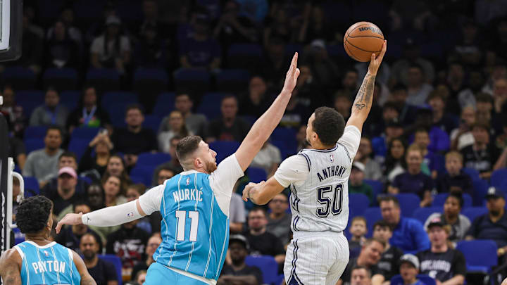 Feb 12, 2025; Orlando, Florida, USA; Orlando Magic guard Cole Anthony (50) shoots against Charlotte Hornets center Jusuf Nurkic (11) during the first quarter at Kia Center. Mandatory Credit: Mike Watters-Imagn Images