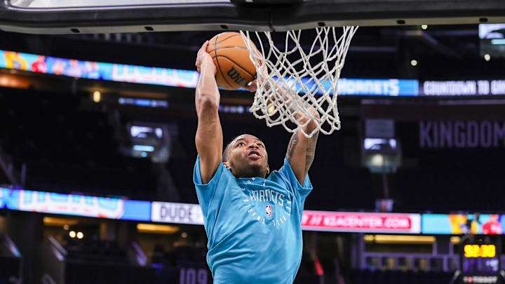 Feb 12, 2025; Orlando, Florida, USA; Charlotte Hornets guard Nick Smith Jr. (8) warms up before the game against the Orlando Magic at Kia Center. Mandatory Credit: Mike Watters-Imagn Images