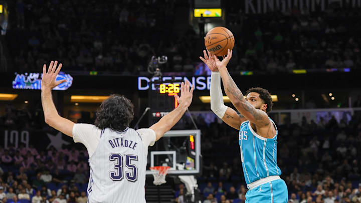 Feb 12, 2025; Orlando, Florida, USA; Charlotte Hornets forward Miles Bridges (0) shoots over Orlando Magic center Goga Bitadze (35) during the first quarter at Kia Center. Mandatory Credit: Mike Watters-Imagn Images Feb 12, 2025; Orlando, Florida, USA; Charlotte Hornets forward Miles Bridges (0) shoots over Orlando Magic center Goga Bitadze (35) during the first quarter at Kia Center. Mandatory Credit: Mike Watters-Imagn Images