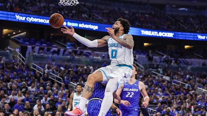 Charlotte Hornets forward Miles Bridges (0) is fouled by Orlando Magic guard Desmond Bane 
