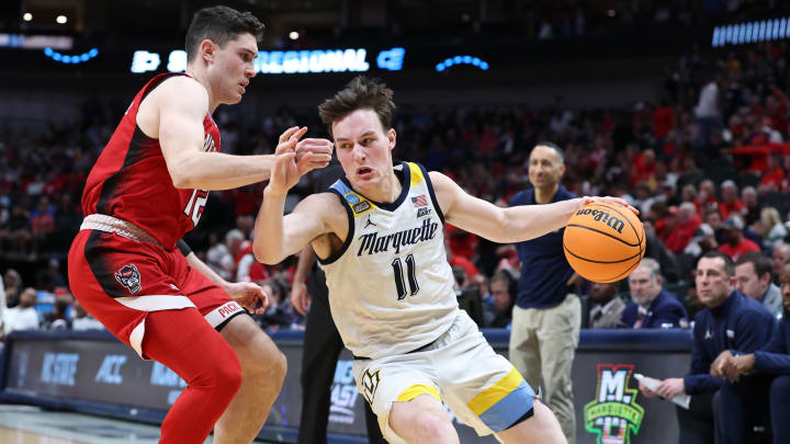 Mar 29, 2024; Dallas, TX, USA; Marquette Golden Eagles guard Tyler Kolek (11) dribble against North Carolina State Wolfpack guard Michael O'Connell (12) during the second half in the semifinals of the South Regional of the 2024 NCAA Tournament at American Airlines Center. Mandatory Credit: Tim Heitman-USA TODAY Sports Mar 29, 2024; Dallas, TX, USA; Marquette Golden Eagles guard Tyler Kolek (11) dribble against North Carolina State Wolfpack guard Michael O'Connell (12) during the second half in the semifinals of the South Regional of the 2024 NCAA Tournament at American Airlines Center. Mandatory Credit: Tim Heitman-USA TODAY Sports