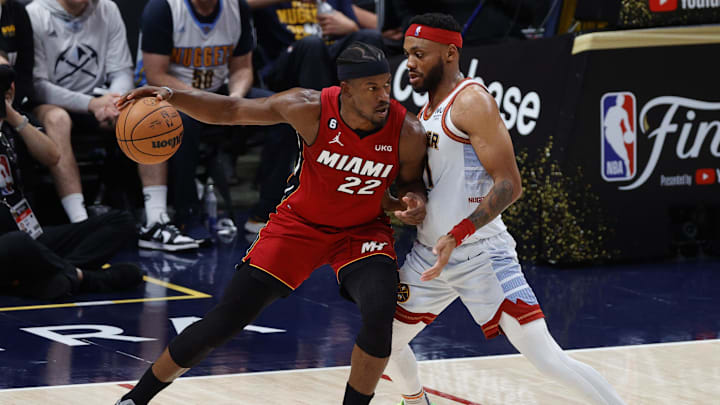 Jun 12, 2023; Denver, Colorado, USA; Miami Heat forward Jimmy Butler (22) drives against Denver Nuggets forward Bruce Brown (11) during the second quarter of game five of the 2023 NBA Finals at Ball Arena. Mandatory Credit: Isaiah J. Downing-Imagn Images
