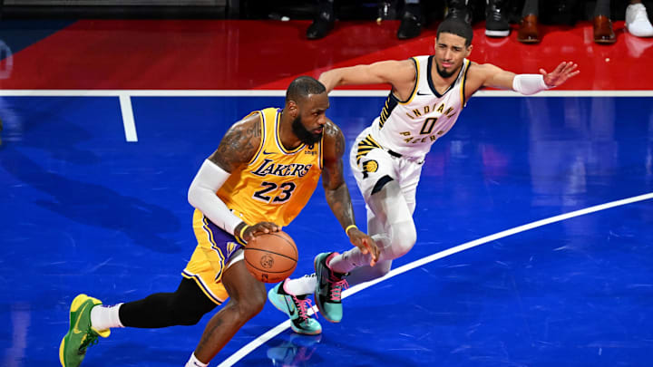 Dec 9, 2023; Las Vegas, Nevada, USA; Los Angeles Lakers forward LeBron James (23) dribbles against Indiana Pacers guard Tyrese Haliburton (0) during the fourth quarter of the NBA In-Season Tournament Championship game at T-Mobile Arena. Mandatory Credit: Candice Ward-Imagn Images