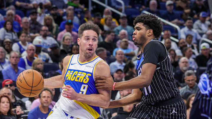 Mar 23, 2026; Orlando, Florida, USA; Indiana Pacers center Micah Potter (11) drives to the basket against Orlando Magic guard Jase Richardson (11) during the second half at Kia Center. Mandatory Credit: Mike Watters-Imagn Images